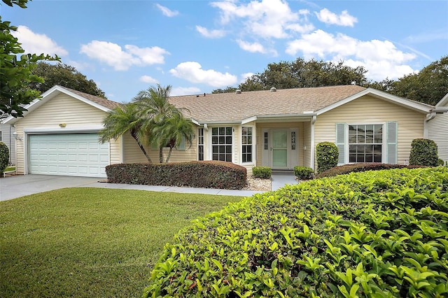 ranch-style home featuring a front yard and a garage