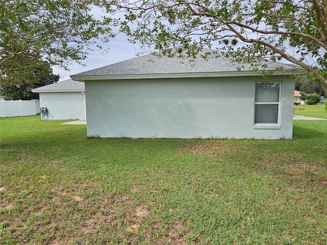 view of home's exterior with a lawn