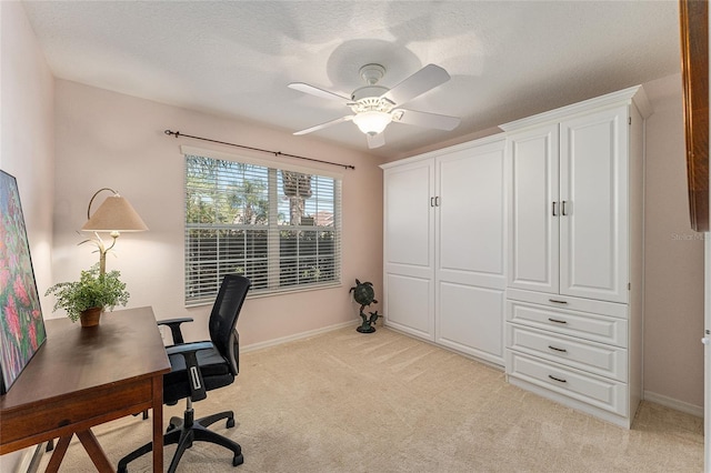 office area featuring ceiling fan and light colored carpet