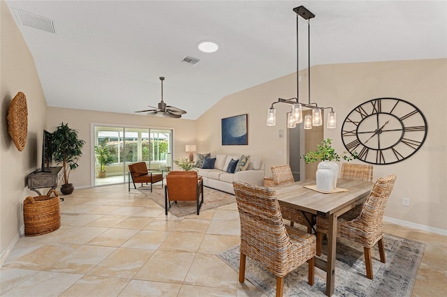 tiled dining room featuring ceiling fan and vaulted ceiling