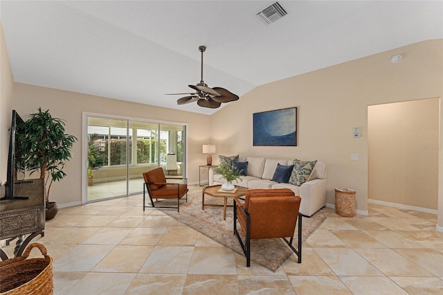 living room featuring lofted ceiling, light tile patterned floors, and ceiling fan