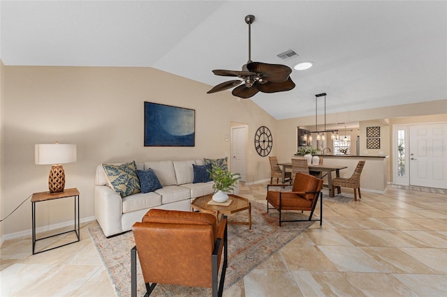 living room with ceiling fan and lofted ceiling