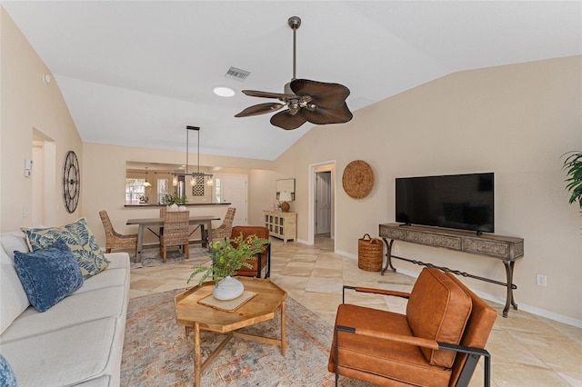 tiled living room featuring lofted ceiling and ceiling fan