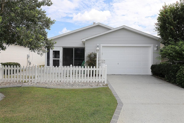 ranch-style home featuring a garage and a front lawn