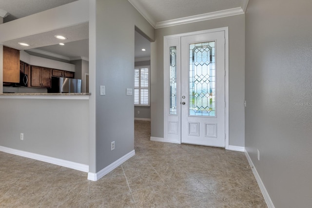 foyer entrance featuring crown molding