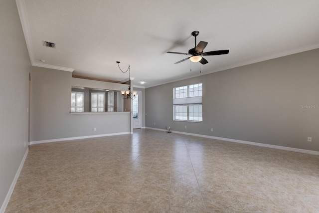 empty room featuring plenty of natural light, ornamental molding, and ceiling fan with notable chandelier