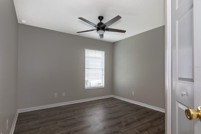 empty room with ceiling fan and dark hardwood / wood-style floors