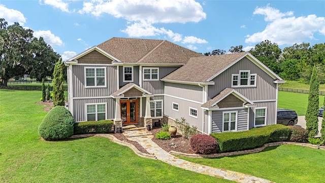 craftsman house featuring a front yard