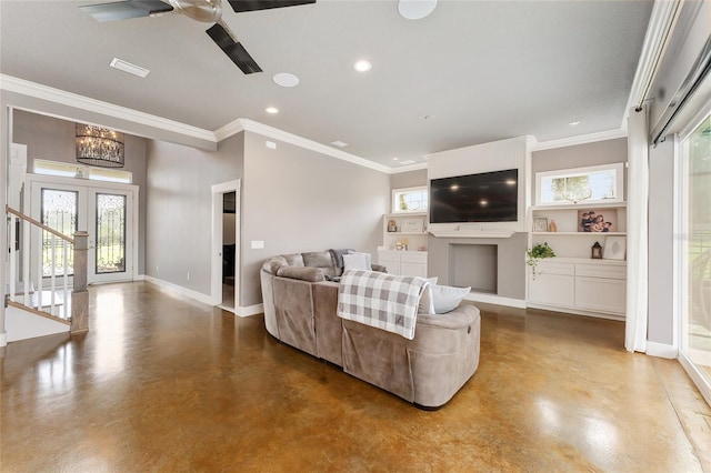 living room featuring concrete floors, crown molding, and built in features