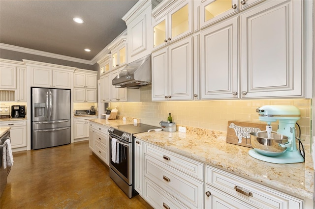 kitchen with light stone counters, tasteful backsplash, white cabinetry, appliances with stainless steel finishes, and crown molding