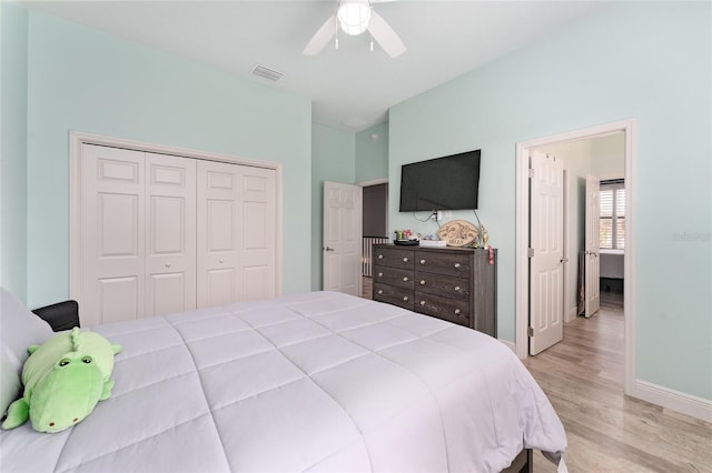 bedroom with ceiling fan, a closet, and light hardwood / wood-style floors