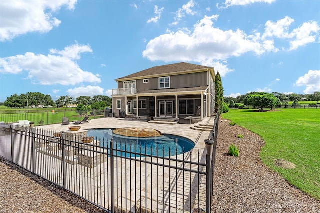 view of pool featuring a sunroom, a yard, and a patio