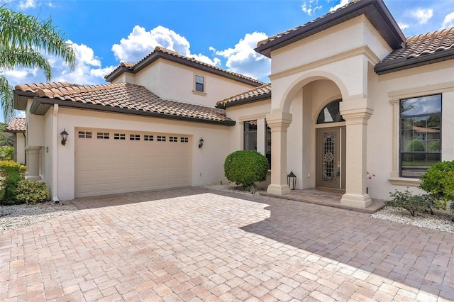 mediterranean / spanish house featuring a garage