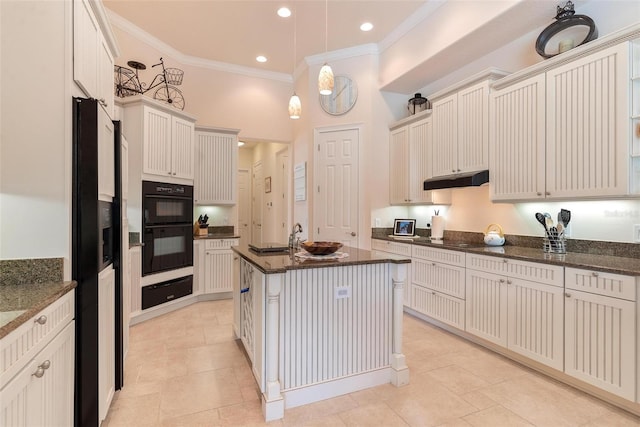 kitchen with black appliances, an island with sink, dark stone counters, pendant lighting, and ornamental molding