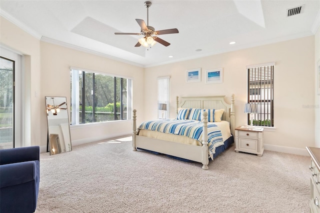 bedroom with light carpet, crown molding, and ceiling fan