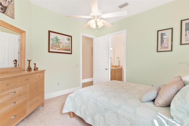 carpeted bedroom with connected bathroom and ceiling fan