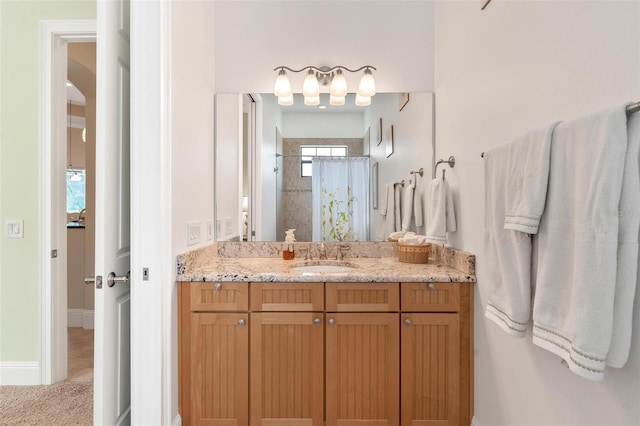 bathroom with vanity and curtained shower