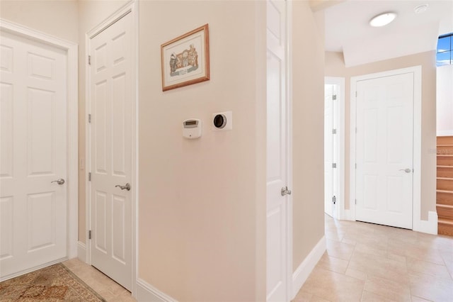 hallway featuring light tile patterned floors