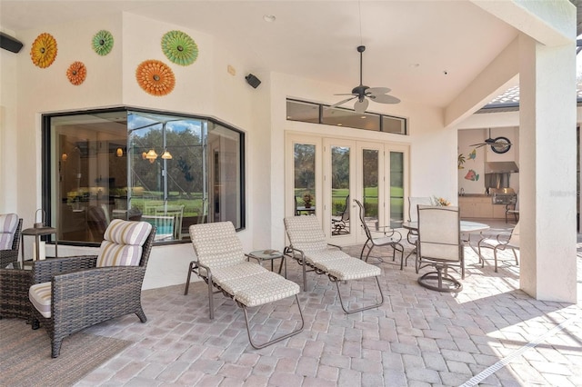 view of patio featuring french doors and ceiling fan