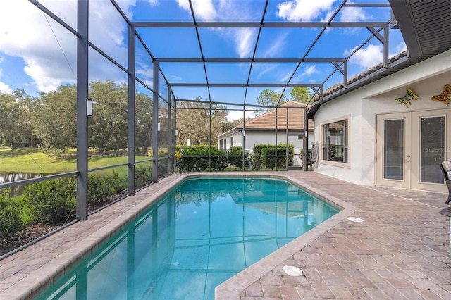 view of pool featuring a patio area and glass enclosure