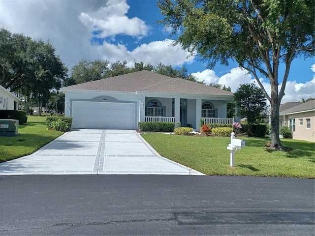 view of front of property with a garage, a front lawn, and covered porch