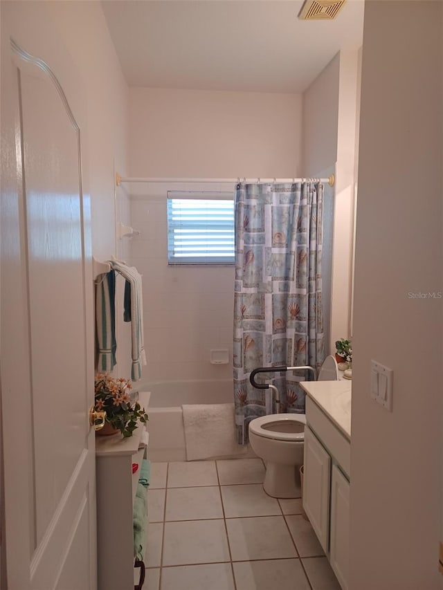 full bathroom with shower / bath combo with shower curtain, tile patterned flooring, vanity, and toilet