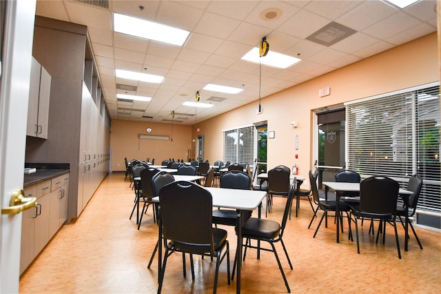 dining room featuring a paneled ceiling