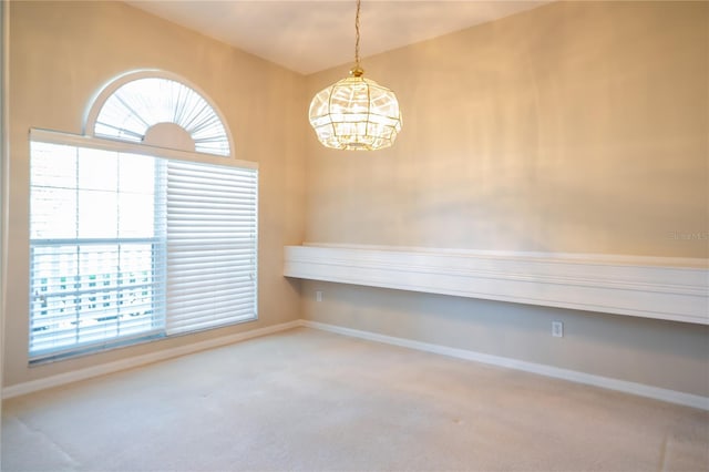 interior space featuring carpet flooring and baseboards