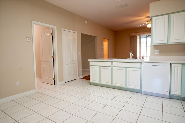 kitchen featuring light tile patterned floors, dishwasher, light countertops, and a sink