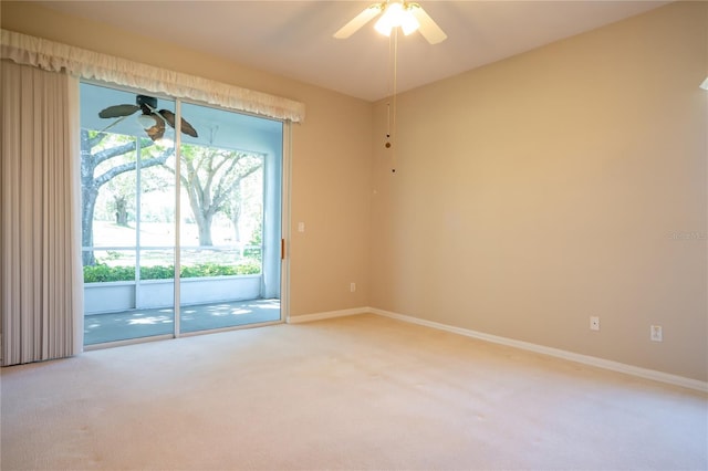 spare room with baseboards, carpet floors, and ceiling fan