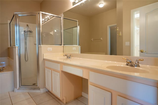 full bathroom featuring a sink, a stall shower, and tile patterned floors