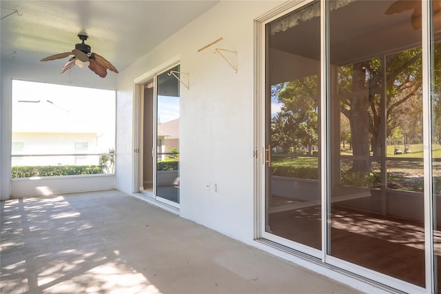 exterior space with ceiling fan