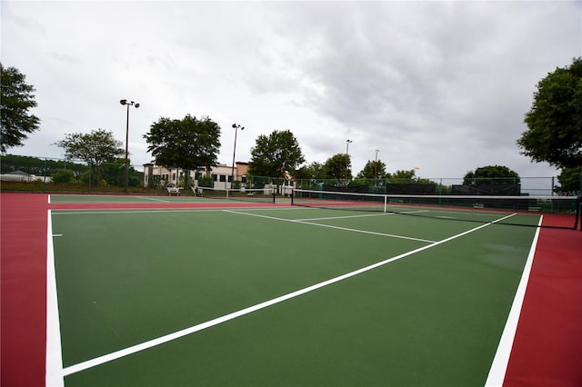 view of sport court featuring community basketball court and fence