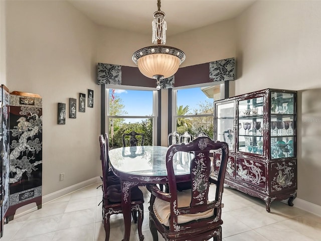 tiled dining room with vaulted ceiling