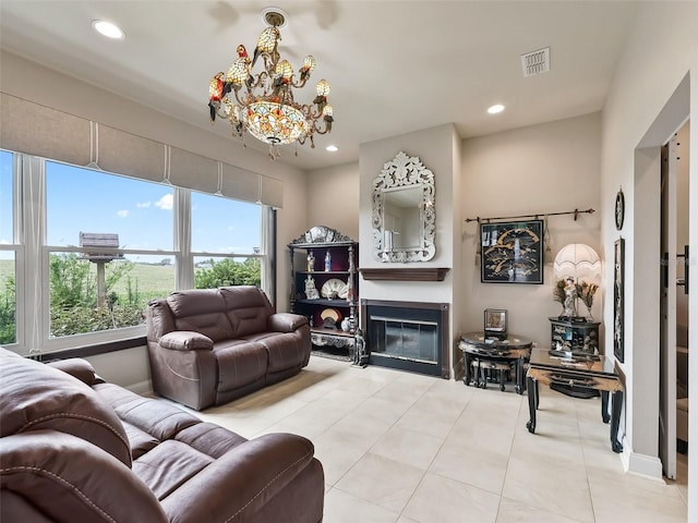 living room with a notable chandelier and light tile patterned floors