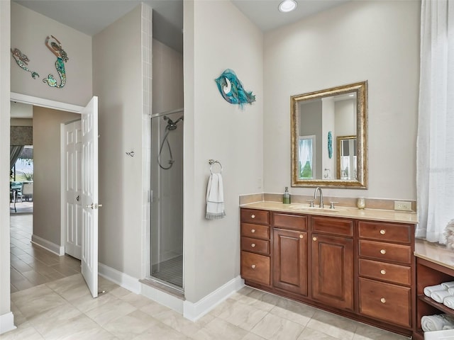 bathroom featuring vanity and a shower with shower door