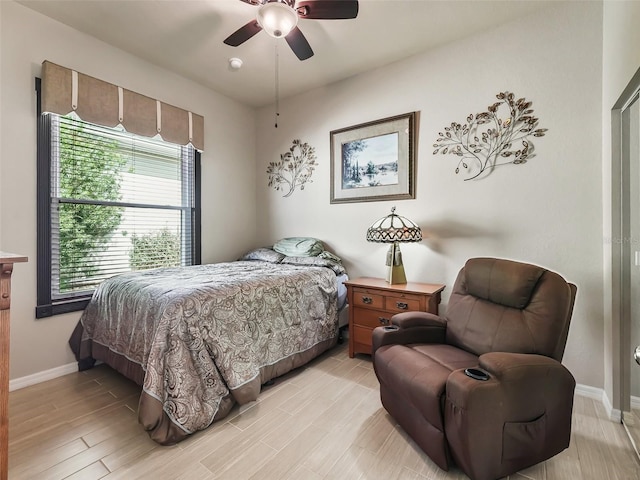 bedroom featuring light hardwood / wood-style flooring and ceiling fan