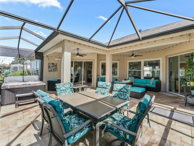 view of patio / terrace featuring a hot tub, a lanai, an outdoor hangout area, and ceiling fan