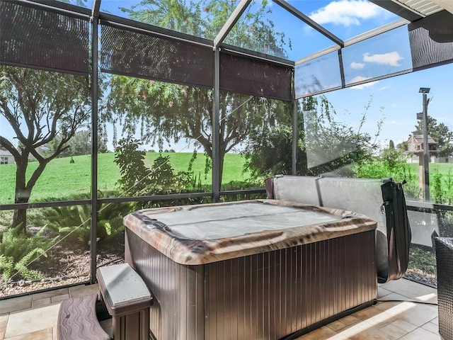 sunroom / solarium featuring a hot tub and plenty of natural light