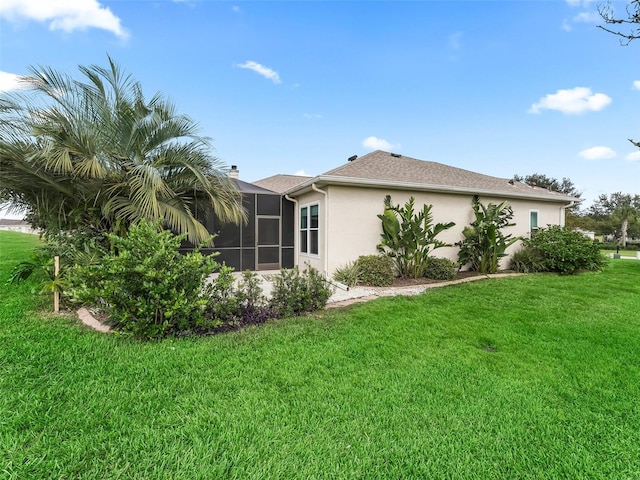 view of side of home featuring a yard