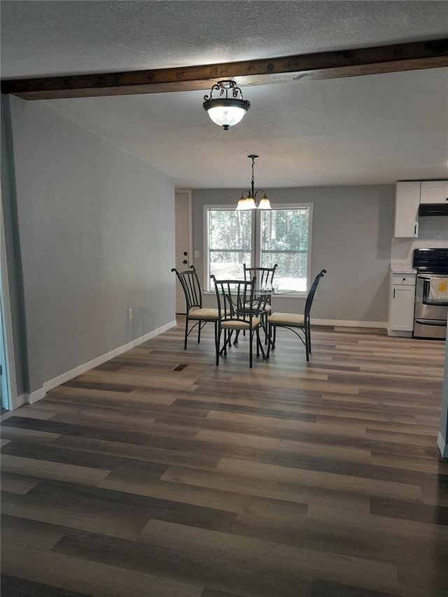 dining area featuring beam ceiling and dark hardwood / wood-style floors