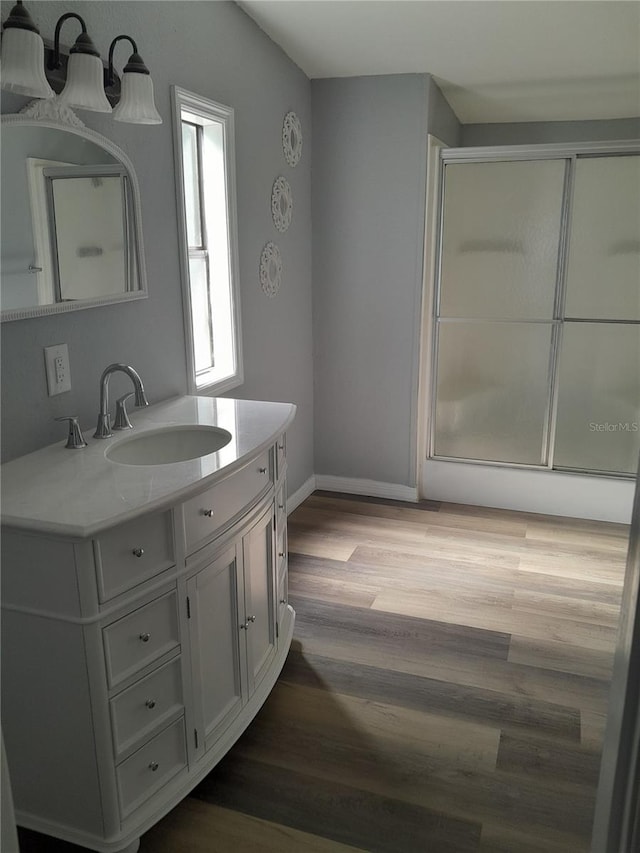 bathroom featuring hardwood / wood-style flooring and vanity