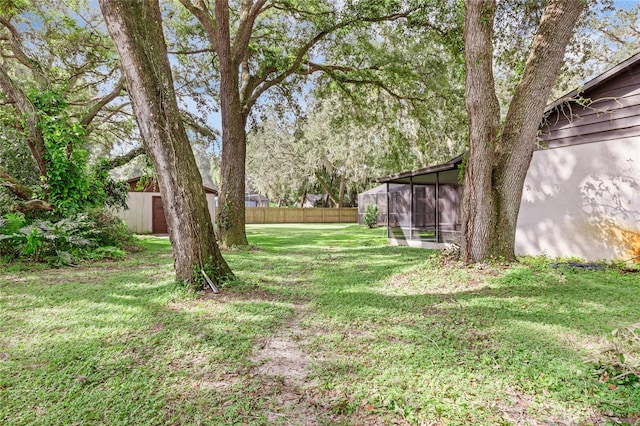 view of yard featuring a sunroom