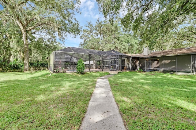 view of yard with a lanai