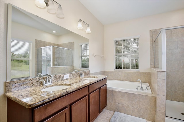 bathroom with vanity, separate shower and tub, tile patterned floors, and a wealth of natural light