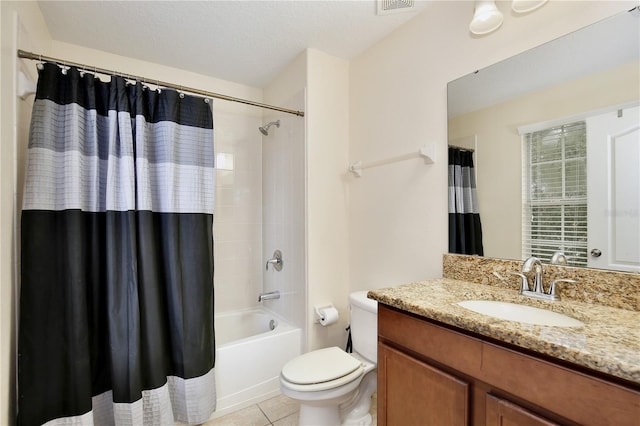 full bathroom with shower / bath combination with curtain, vanity, toilet, a textured ceiling, and tile patterned flooring