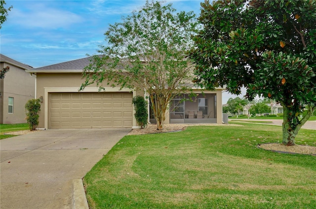 view of front of house with a garage and a front yard