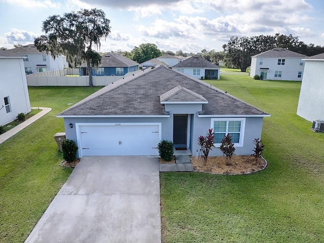 single story home featuring central AC, a garage, and a front lawn