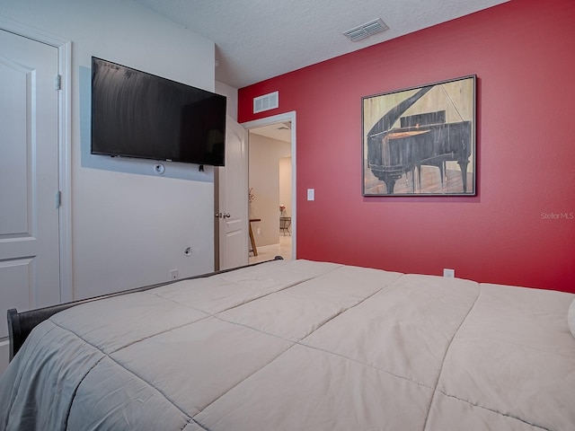 bedroom with a textured ceiling