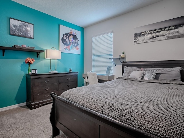 bedroom with light colored carpet